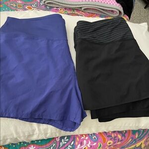 Two pair of pull on athletic shorts small-4-6. Have zip pkt in back waist 
Guc